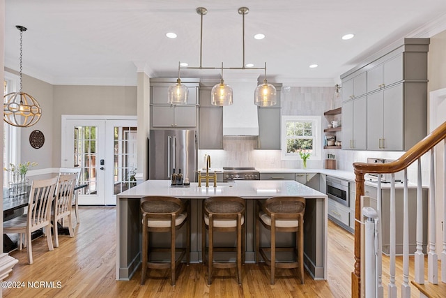 6920 Runningbrook Ter, Wilmington, NC 28411 - kitchen featuring gray cabinets, appliances with stainless steel finishes, french doors, crown molding, and light countertops