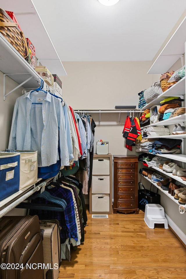 6920 Runningbrook Ter, Wilmington, NC 28411 - walk in closet featuring light wood-type flooring