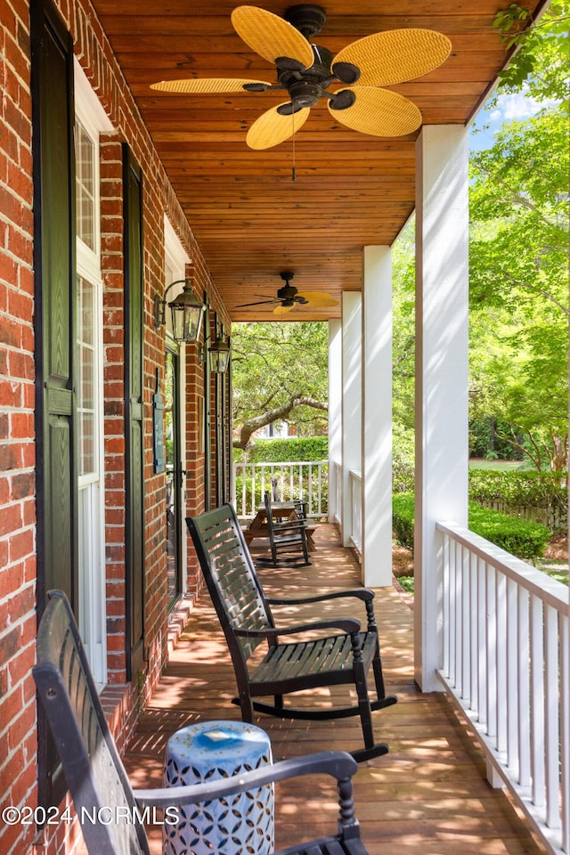 6920 Runningbrook Ter, Wilmington, NC 28411 - wooden deck with a porch and a ceiling fan