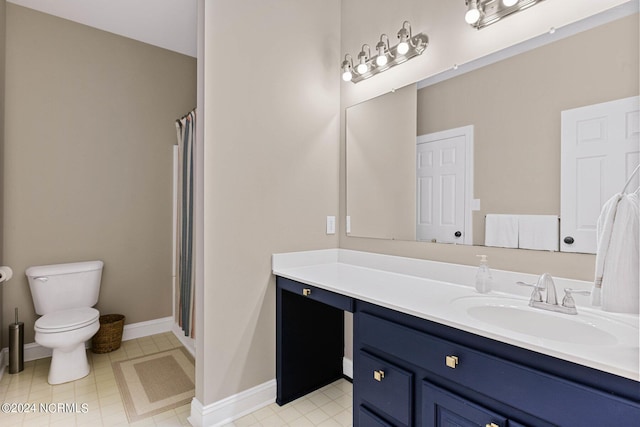 6920 Runningbrook Ter, Wilmington, NC 28411 - bathroom featuring vanity, toilet, a shower with curtain, and baseboards