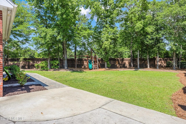 6920 Runningbrook Ter, Wilmington, NC 28411 - view of yard with a playground, a patio area, and view of scattered trees