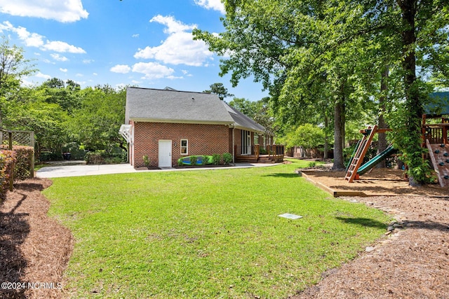 6920 Runningbrook Ter, Wilmington, NC 28411 - view of grassy yard with a playground