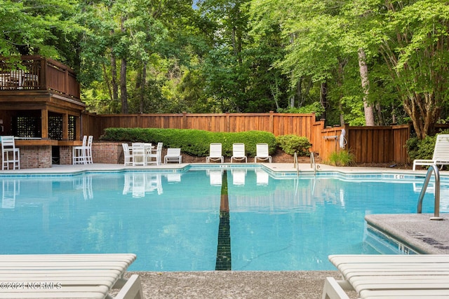 6920 Runningbrook Ter, Wilmington, NC 28411 - view of swimming pool featuring a fenced backyard and view of scattered trees