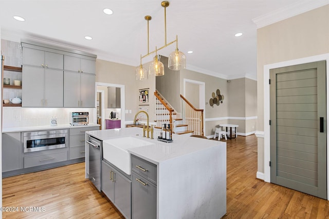 6920 Runningbrook Ter, Wilmington, NC 28411 - kitchen with gray cabinets, a sink, ornamental molding, stainless steel dishwasher, and open shelves