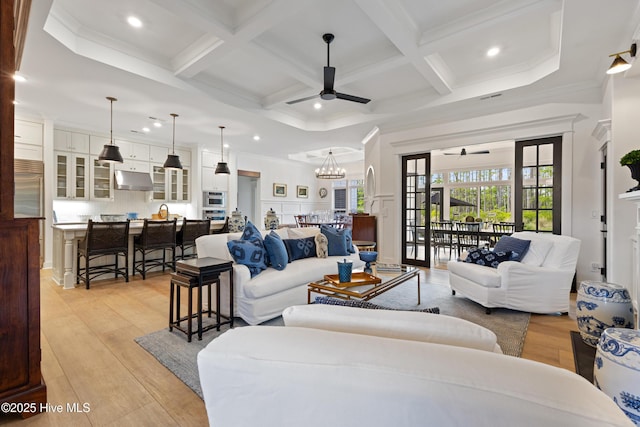 living room featuring a ceiling fan, coffered ceiling, beam ceiling, recessed lighting, and light wood-type flooring