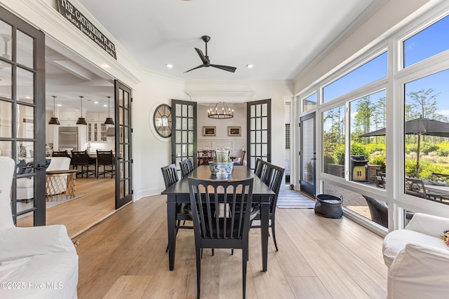 dining room with a chandelier, ornamental molding, light wood finished floors, recessed lighting, and ceiling fan