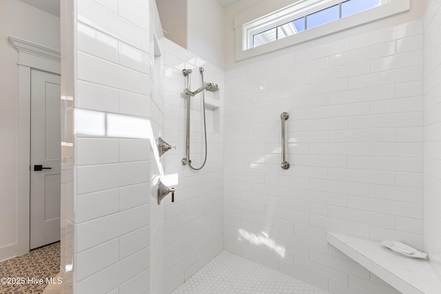 full bath with tiled shower