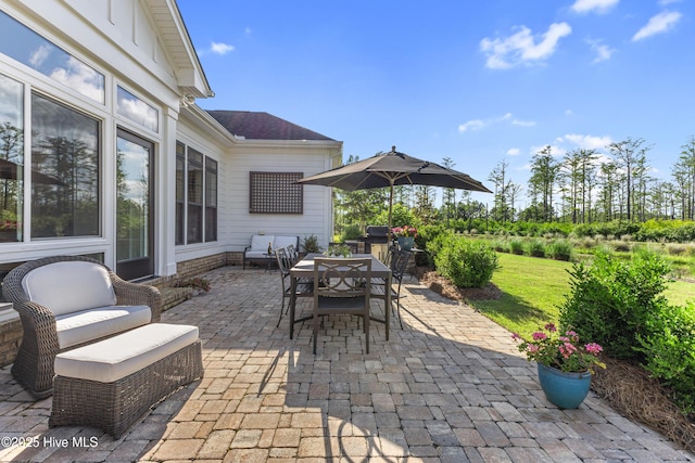 view of patio featuring outdoor dining space and grilling area