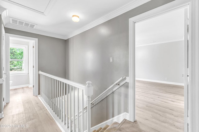 103 E Raintree Ln, Goldsboro, NC 27534 - corridor featuring an upstairs landing, wood finished floors, ornamental molding, and baseboards
