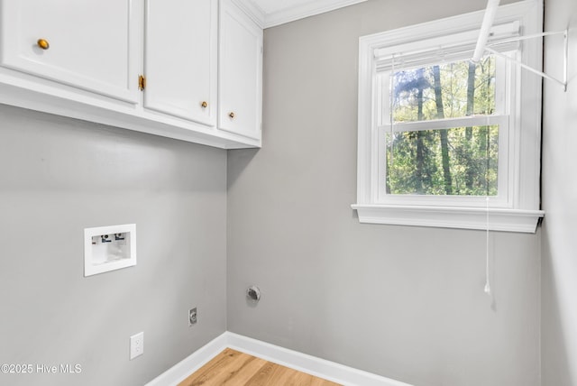 103 E Raintree Ln, Goldsboro, NC 27534 - clothes washing area with cabinet space, washer hookup, baseboards, and light wood-type flooring