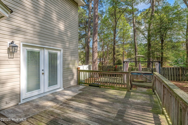 103 E Raintree Ln, Goldsboro, NC 27534 - wooden deck featuring french doors and a fenced backyard