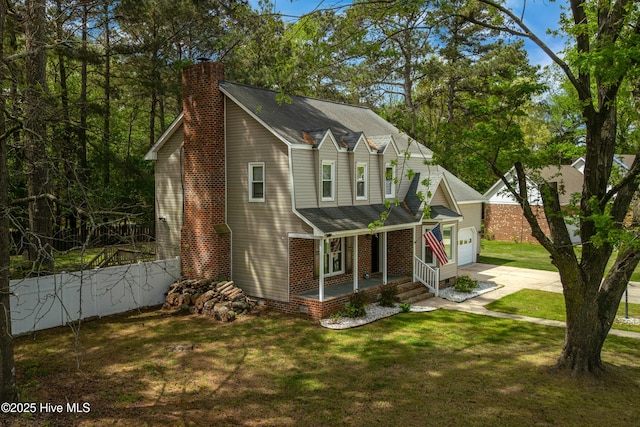 103 E Raintree Ln, Goldsboro, NC 27534 - view of property exterior with a porch, driveway, a chimney, an attached garage, and brick siding