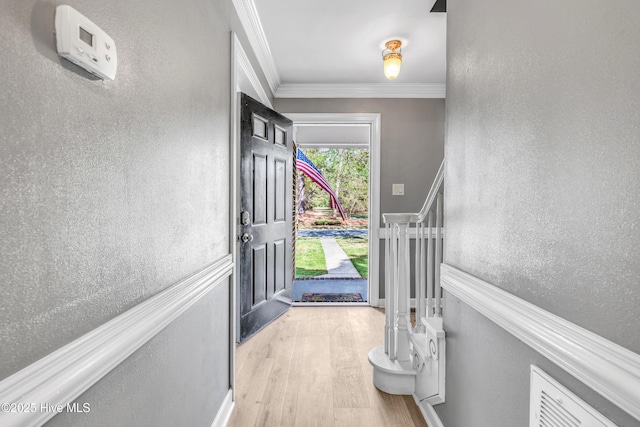 103 E Raintree Ln, Goldsboro, NC 27534 - foyer with wood finished floors, crown molding, and a textured wall