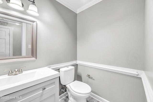 103 E Raintree Ln, Goldsboro, NC 27534 - half bathroom featuring crown molding, toilet, and vanity