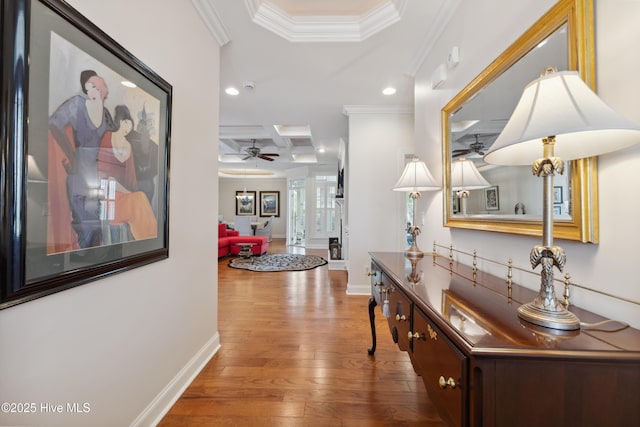hall featuring coffered ceiling, recessed lighting, hardwood / wood-style floors, ornamental molding, and baseboards