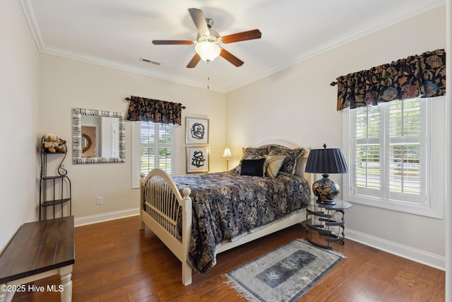 bedroom featuring baseboards, wood finished floors, ornamental molding, and ceiling fan