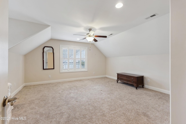 bonus room with a ceiling fan, carpet flooring, lofted ceiling, and baseboards