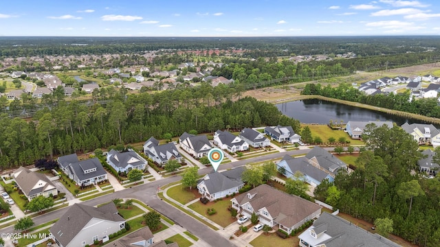 aerial view of residential area with a nearby body of water