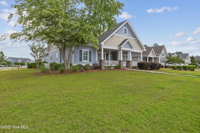 craftsman inspired home with board and batten siding, covered porch, and a front yard