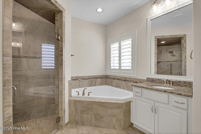 full bath featuring a bath, a shower stall, vanity, and recessed lighting