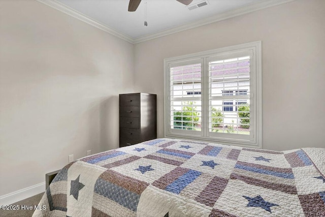 carpeted bedroom with ornamental molding, ceiling fan, and baseboards
