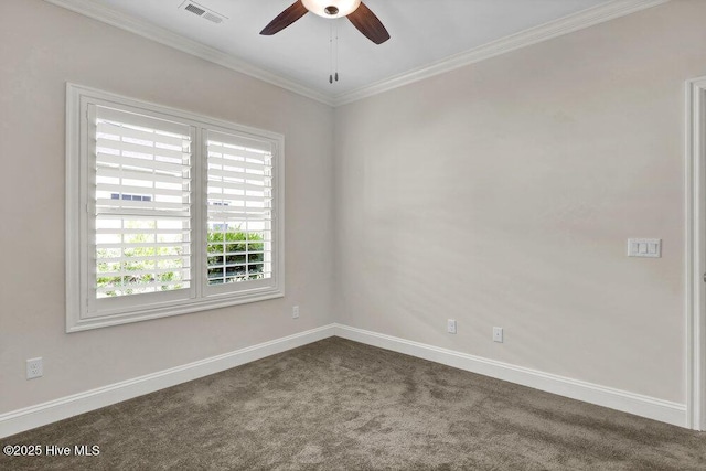 unfurnished room featuring dark carpet, ceiling fan, baseboards, and ornamental molding