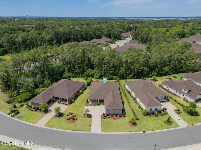 aerial overview of property's location with a forest
