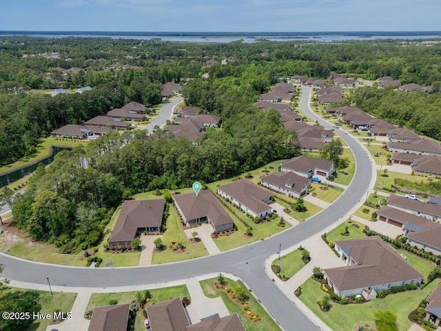 aerial view of property and surrounding area featuring nearby suburban area