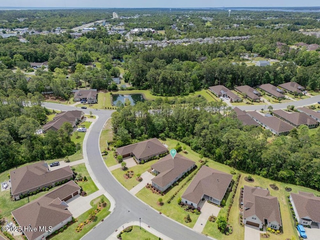 view of property location featuring nearby suburban area and a large body of water