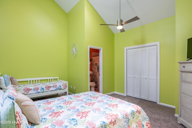 bedroom with high vaulted ceiling, carpet flooring, baseboards, a closet, and connected bathroom