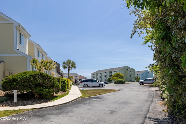 view of asphalt road featuring a residential view