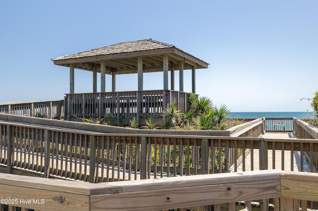 wooden terrace with a water view