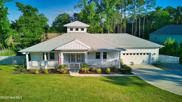 view of front of house featuring a porch, an attached garage, driveway, and a shingled roof