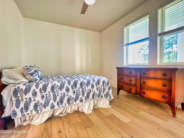 bedroom featuring wood finished floors and a ceiling fan