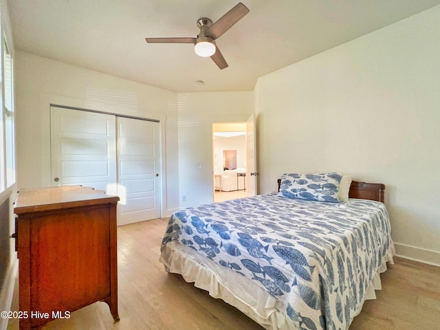 bedroom featuring wood finished floors, baseboards, a closet, and ceiling fan