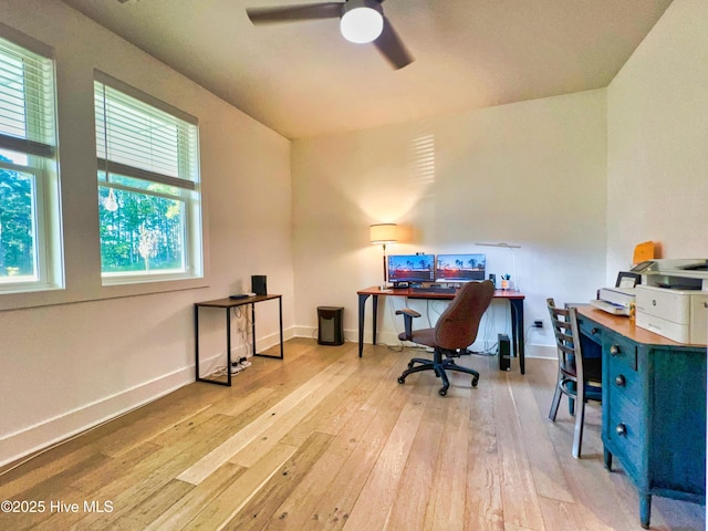 office featuring wood-type flooring, ceiling fan, and baseboards