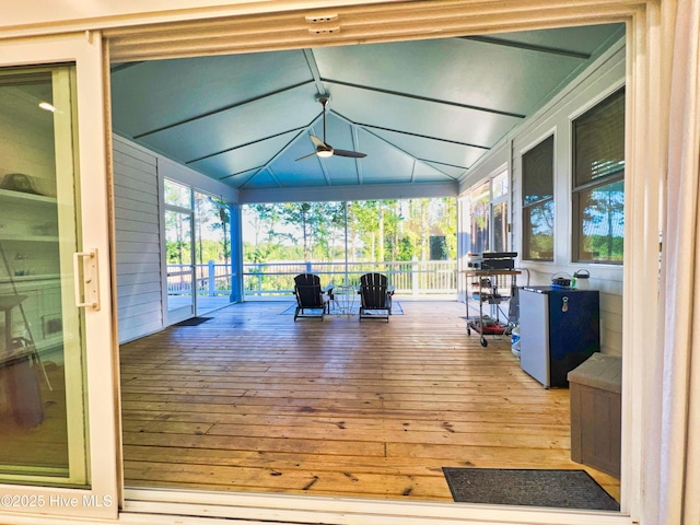 deck with covered porch and ceiling fan