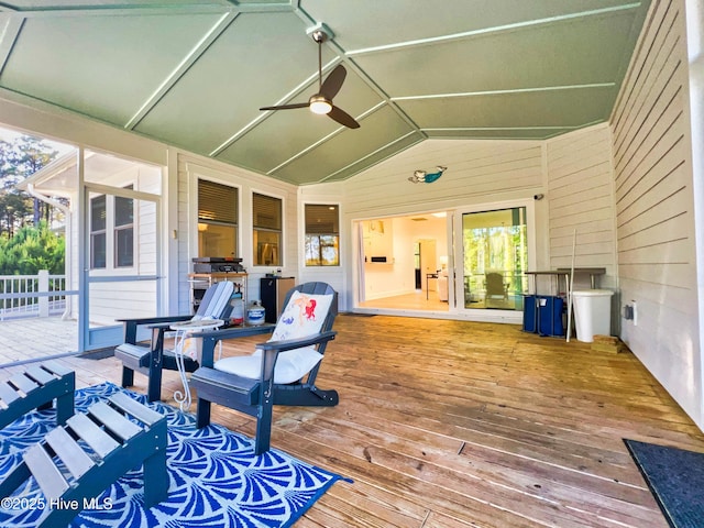 wooden deck with a ceiling fan