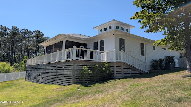 rear view of house with cooling unit, stairway, and a wooden deck