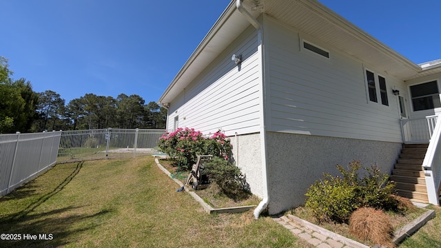 view of side of home with stairway