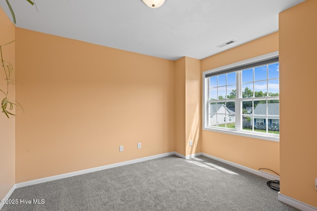 empty room with carpet flooring and baseboards