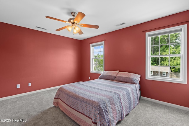 bedroom with carpet floors, baseboards, and a ceiling fan