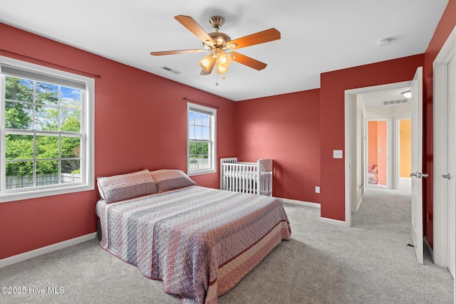 bedroom with carpet, baseboards, and ceiling fan