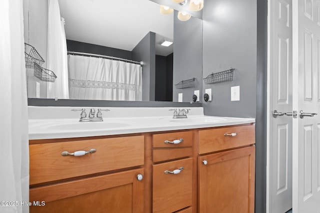 bathroom featuring double vanity