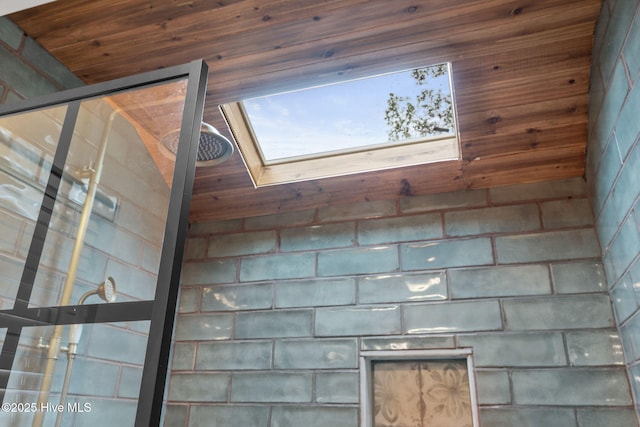 45 Fairway Dr, Shallotte, NC 28470 - bathroom view of a tile shower and a skylight