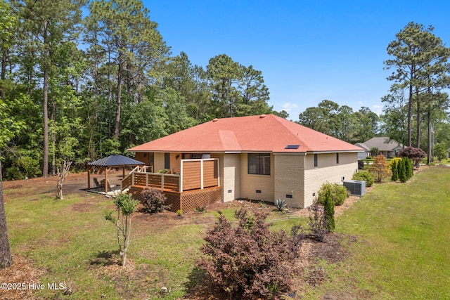 45 Fairway Dr, Shallotte, NC 28470 - back of house featuring crawl space, a gazebo, a wooden deck, a yard, and central AC