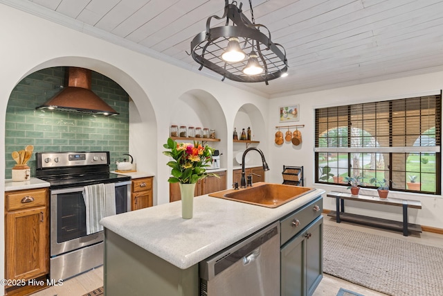 45 Fairway Dr, Shallotte, NC 28470 - kitchen with stainless steel appliances, a sink, wall chimney exhaust hood, ornamental molding, and light wood-style flooring