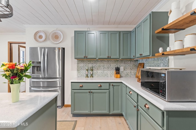 45 Fairway Dr, Shallotte, NC 28470 - kitchen with appliances with stainless steel finishes, green cabinets, open shelves, ornamental molding, and light wood finished floors