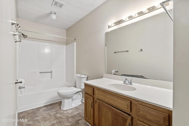 full bath with toilet, vanity, and washtub / shower combination