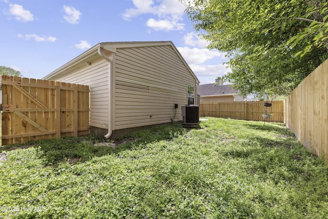 view of yard with central air condition unit